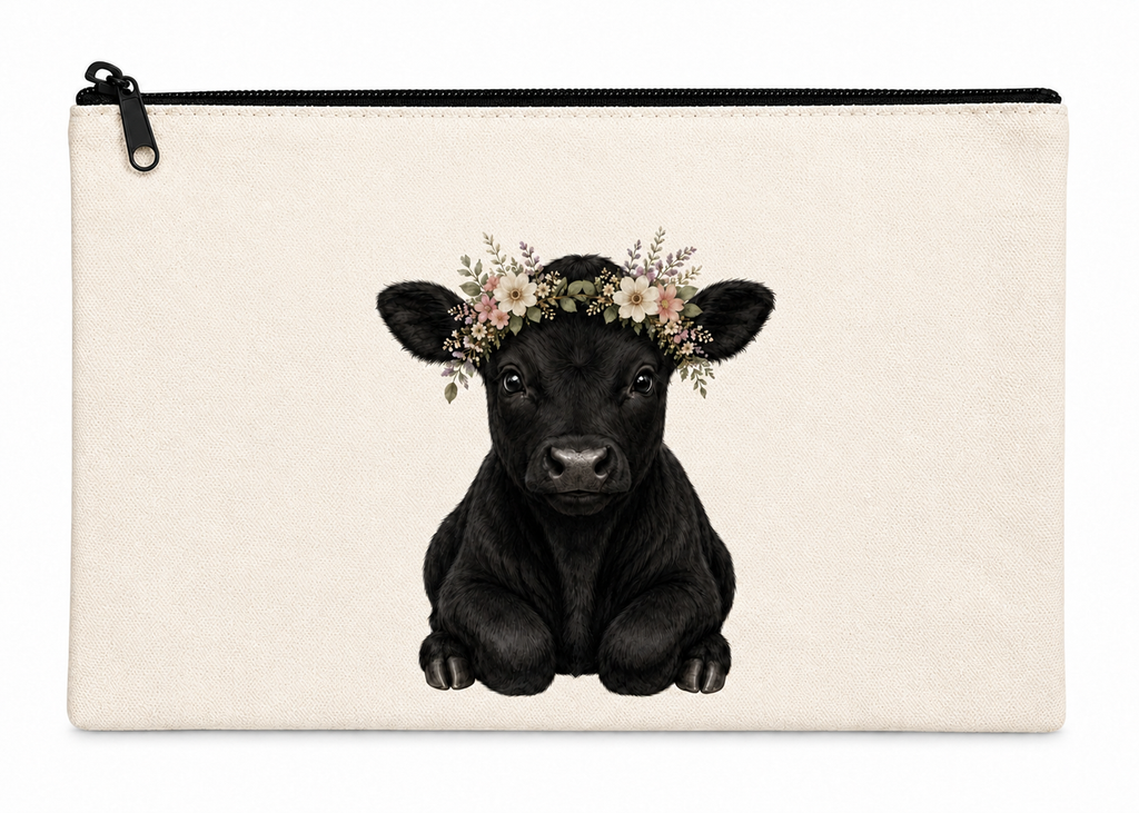 Canvas pouch with a black cow illustration wearing a floral crown on a white background